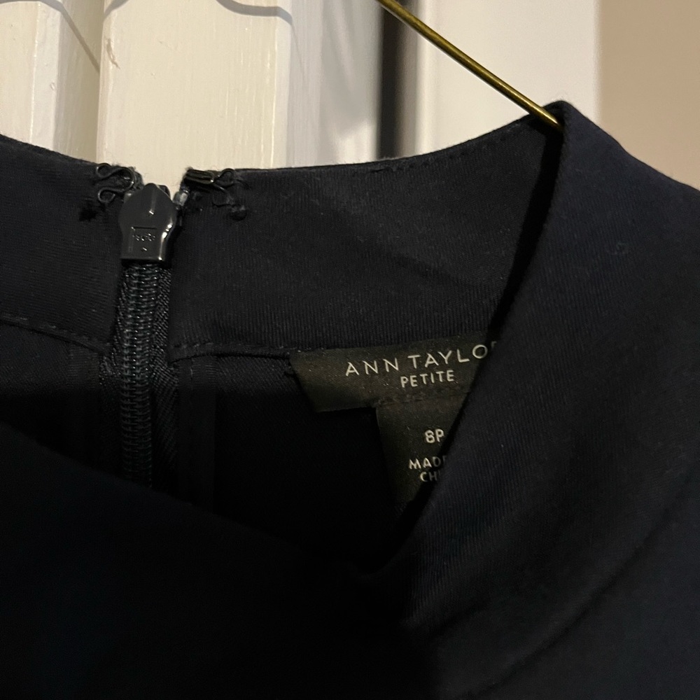 Navy blue size 8P Ann Taylor sleeveless dress. Has a tie, mid length, worn 2x